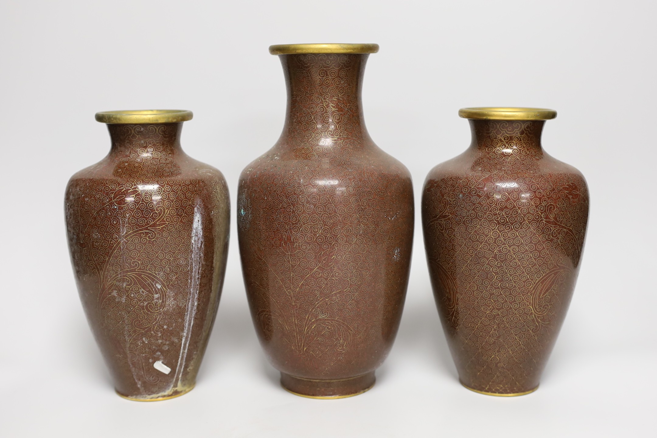 A pair of Chinese cloisonné enamel vases and another (3) 26cms